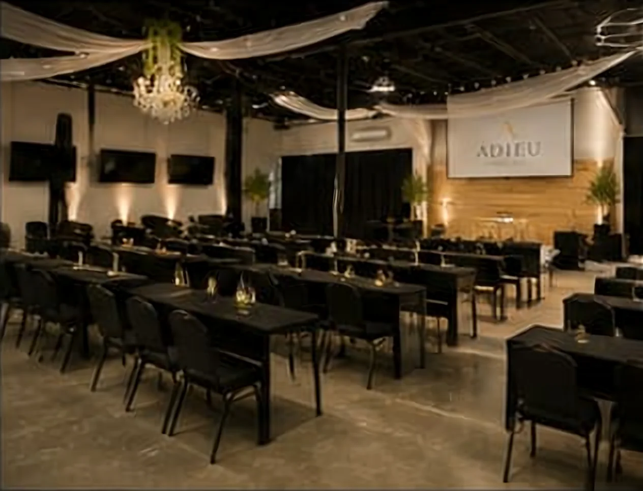 Classroom seminar layout at Adieu Event Space facing the projection screen