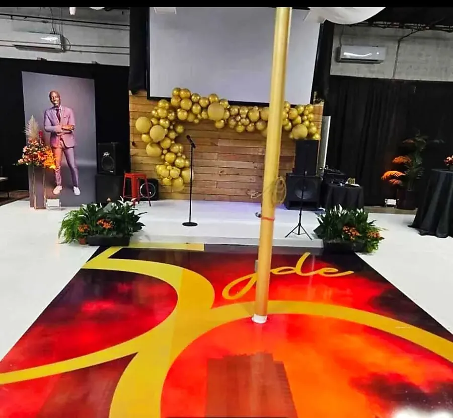 Custom illuminated dance floor with balloon decor